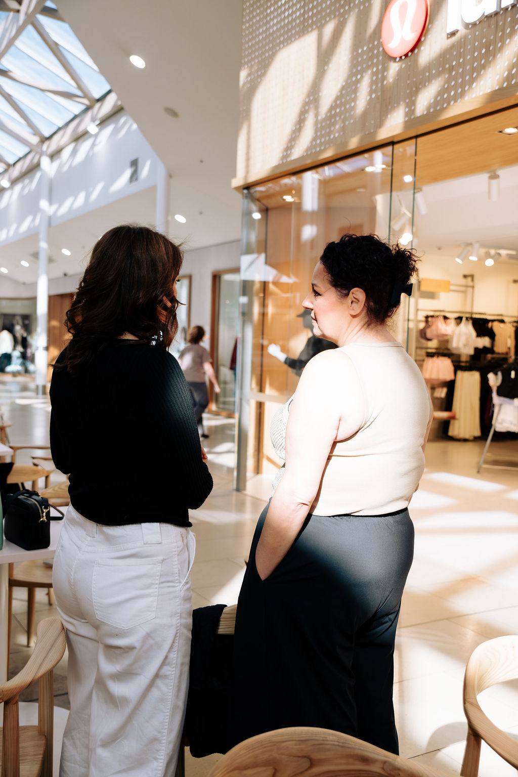 Two women talking quietly at a Business Mums Hub gathering in Adelaide